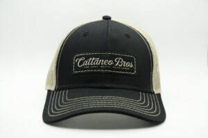Black mesh-back trucker hat with embroidered patch